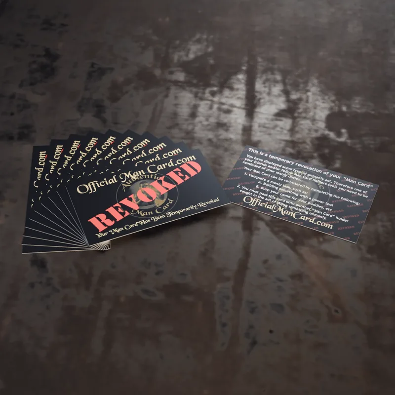 A fan of ten Revoke Cards on a workbench