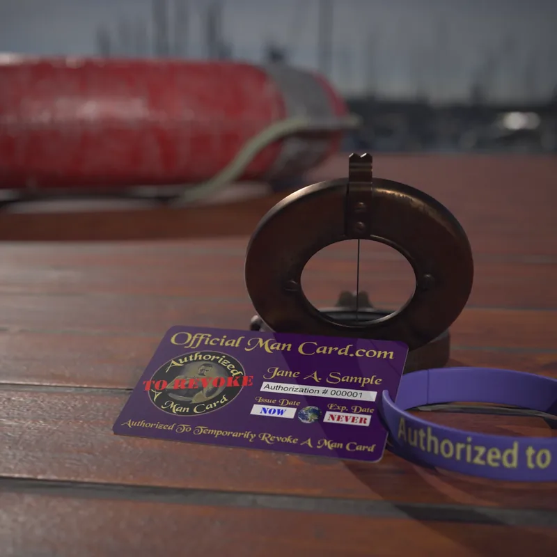 The Authorized To Revoke wallet card on a boat deck